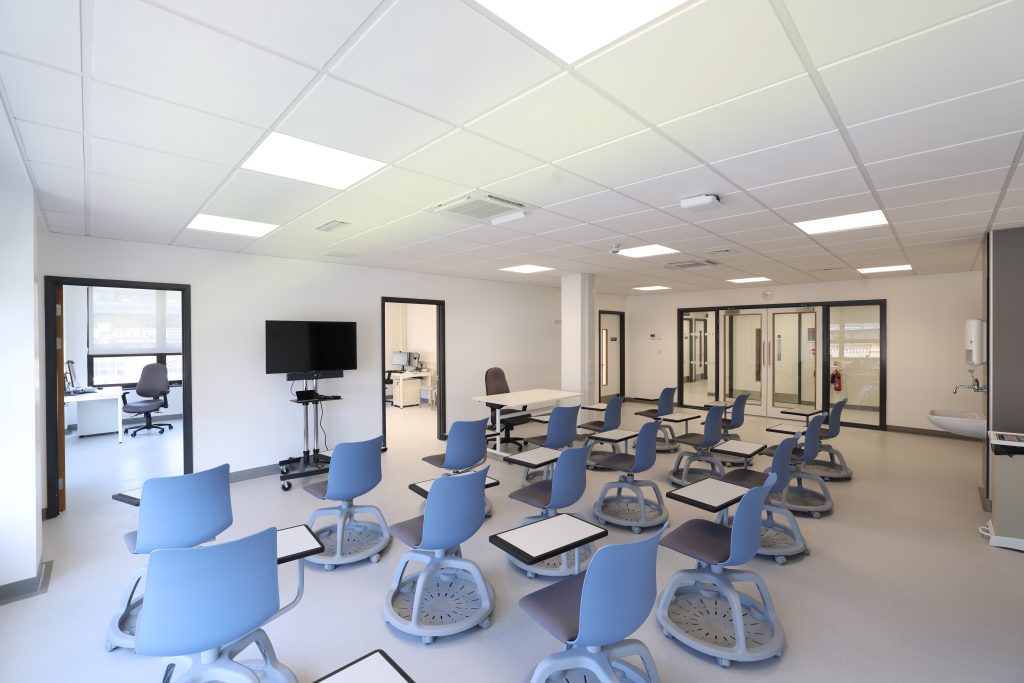 A training room showing individual seating and technology in a classroom style set-up.