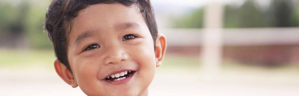 A young boy smiling