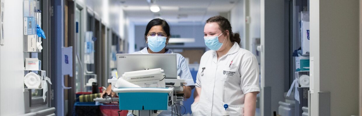 Staff Nurse with student on cancer ward
