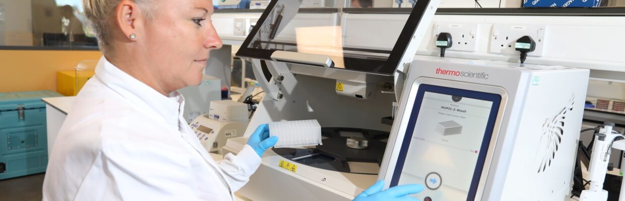 The image shows Caroline Wilson at work in the innovation lab.