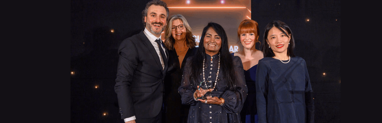 Prof Kunadian is pictured receiving her award on stage with members of the SENIOR-RITA research team