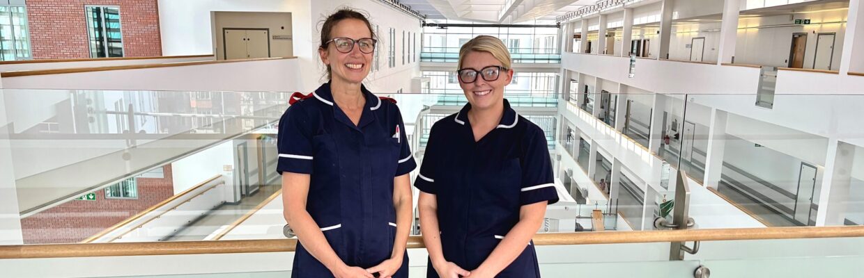Two women in uniform standing together in the RVI