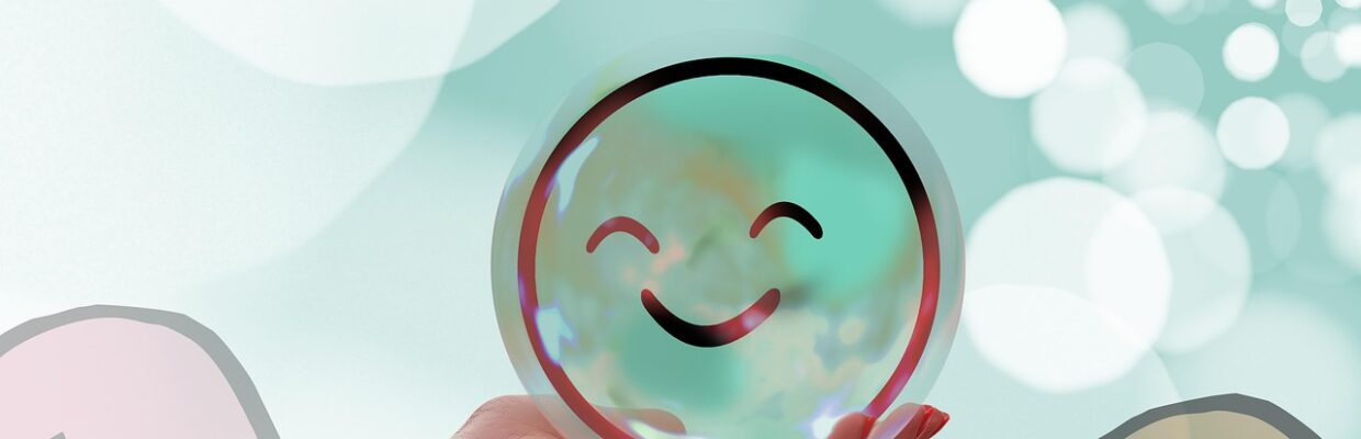 A person holding a smiling bubble