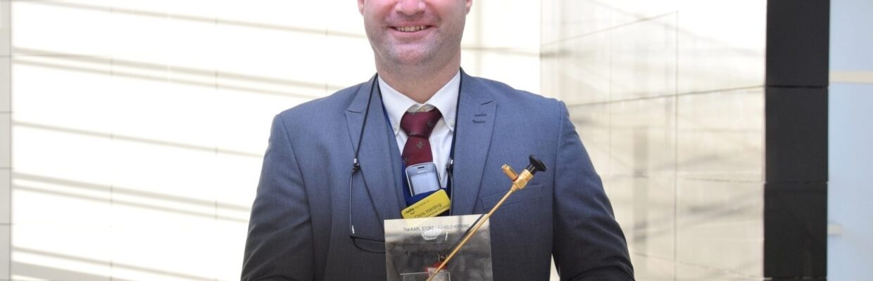 Mr Chris Harding Consultant urologist with his award